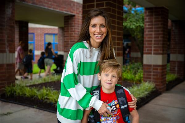 mom and boy student walking into WGES